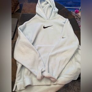 Light blue, fuzzy Nike hooded pullover